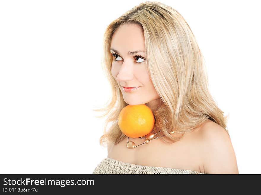 Portrait of a lovely blonde in pullover holding an orange on white background. Portrait of a lovely blonde in pullover holding an orange on white background