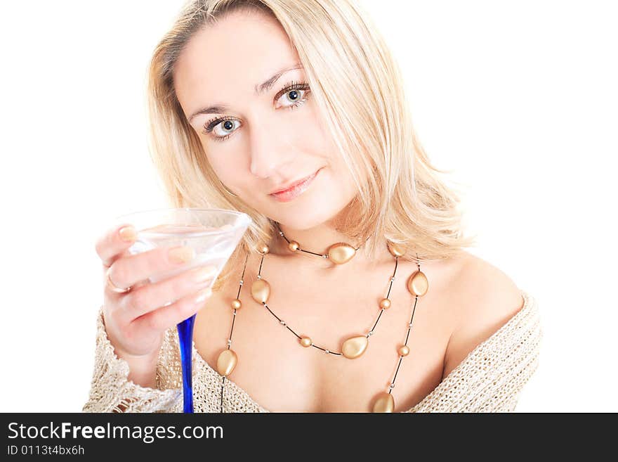 Portrait of a lovely blonde in pullover holding a glass on white background. Portrait of a lovely blonde in pullover holding a glass on white background