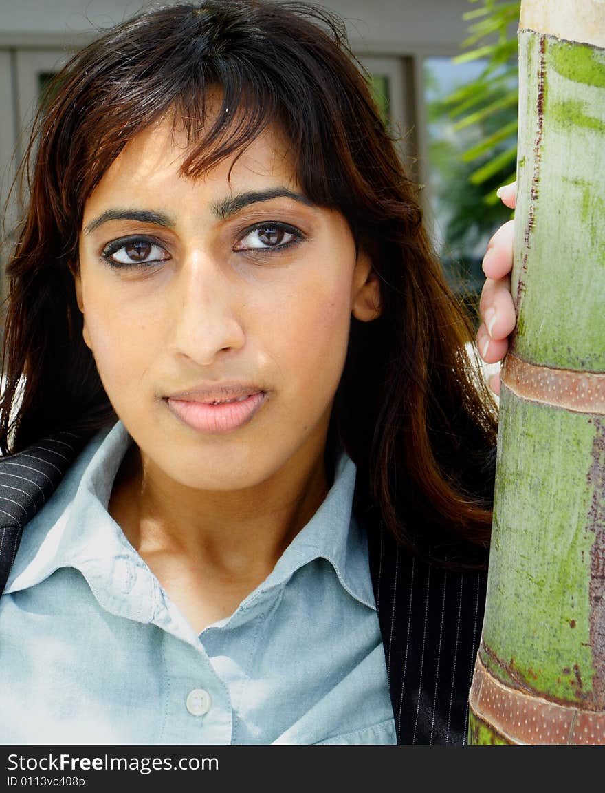 Young Islamic Female Posing For a Headshot next to a Palm Tree