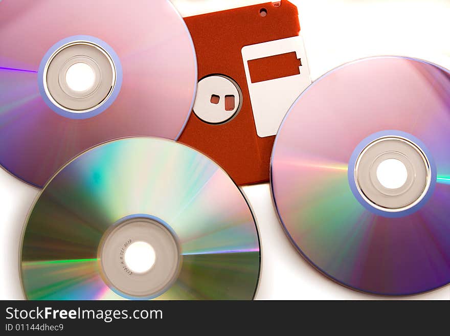 Old diskette under CD - DVD disks. Old diskette under CD - DVD disks