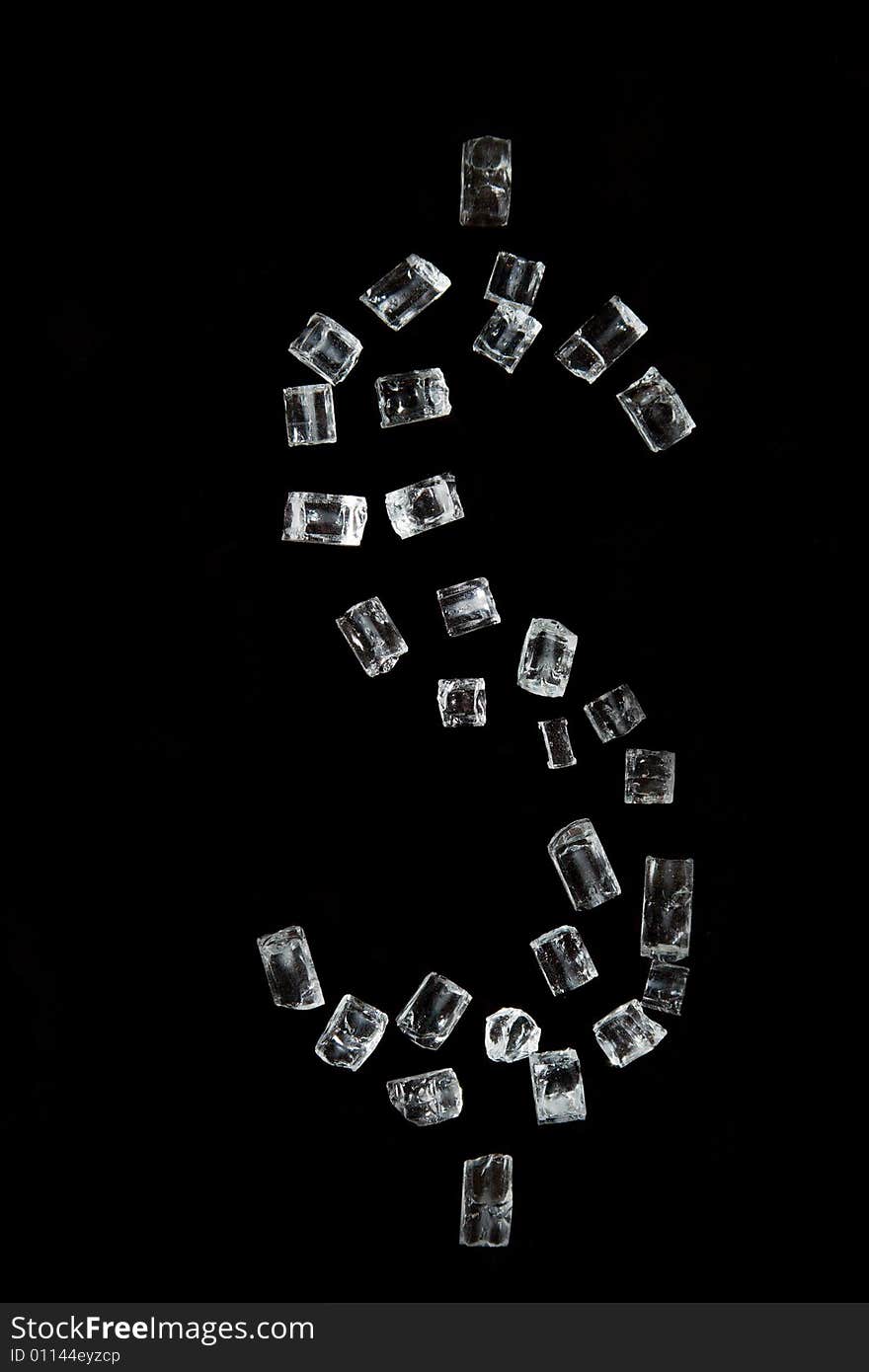 The dollar symbol which has been laid out by crystals, on a black background