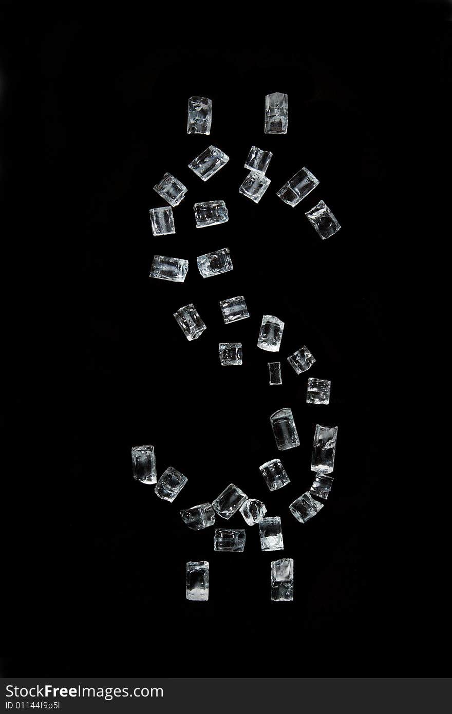 The dollar symbol which has been laid out by crystals, on a black background