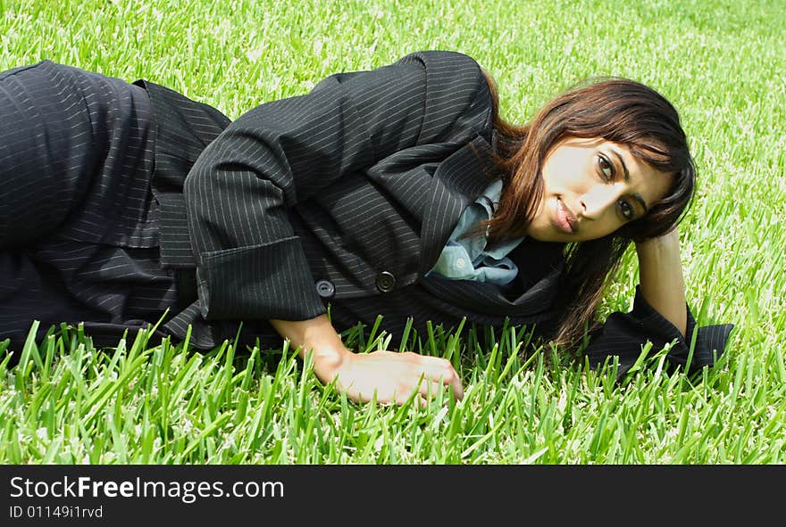 Businesswoman Napping On Grass