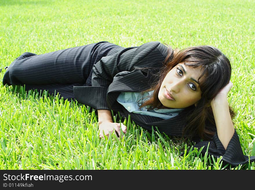 Businesswoman Napping On Grass