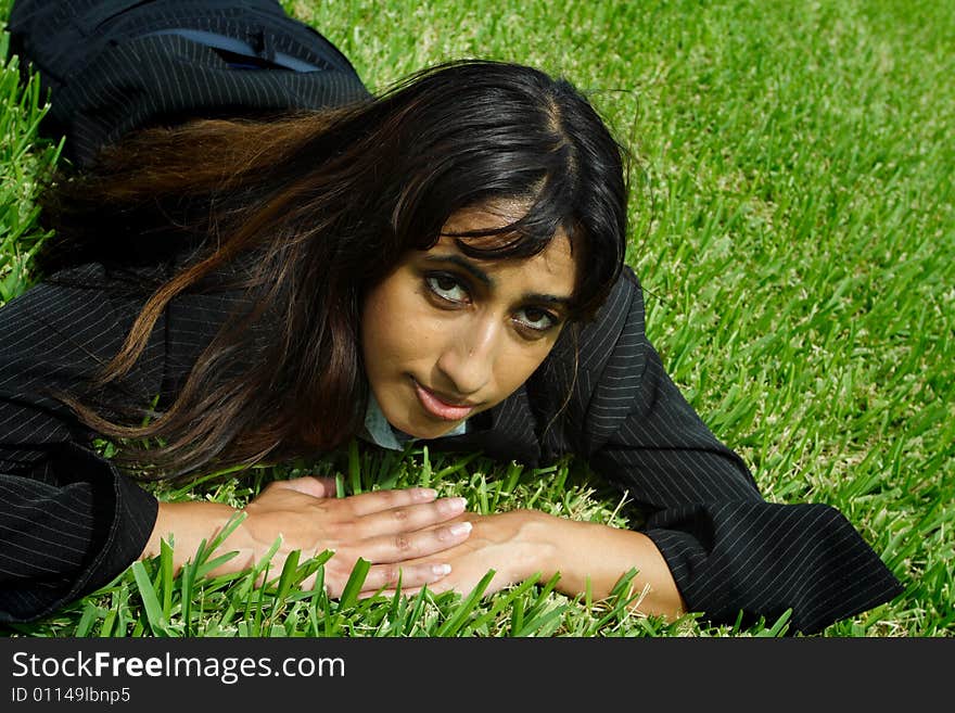 Businesswoman Napping On Grass