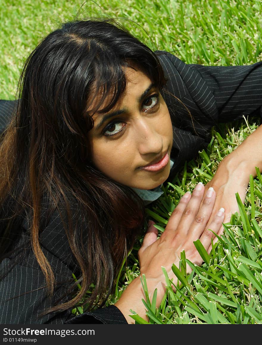 Businesswoman Napping On Grass