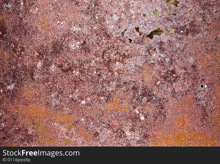 Rusty metal background with some holes