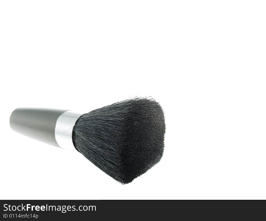 Cosmetic brush in isolated white background.