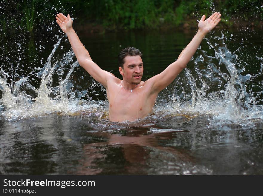 Young man jumps from the water