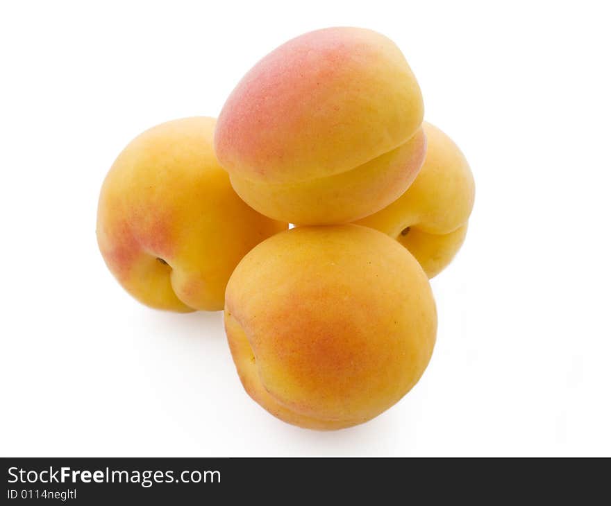 Pile of fresh apricots isolated on white