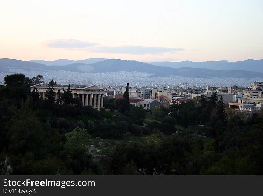 A city view of Athens,Greece with trees in the foreground. A city view of Athens,Greece with trees in the foreground.