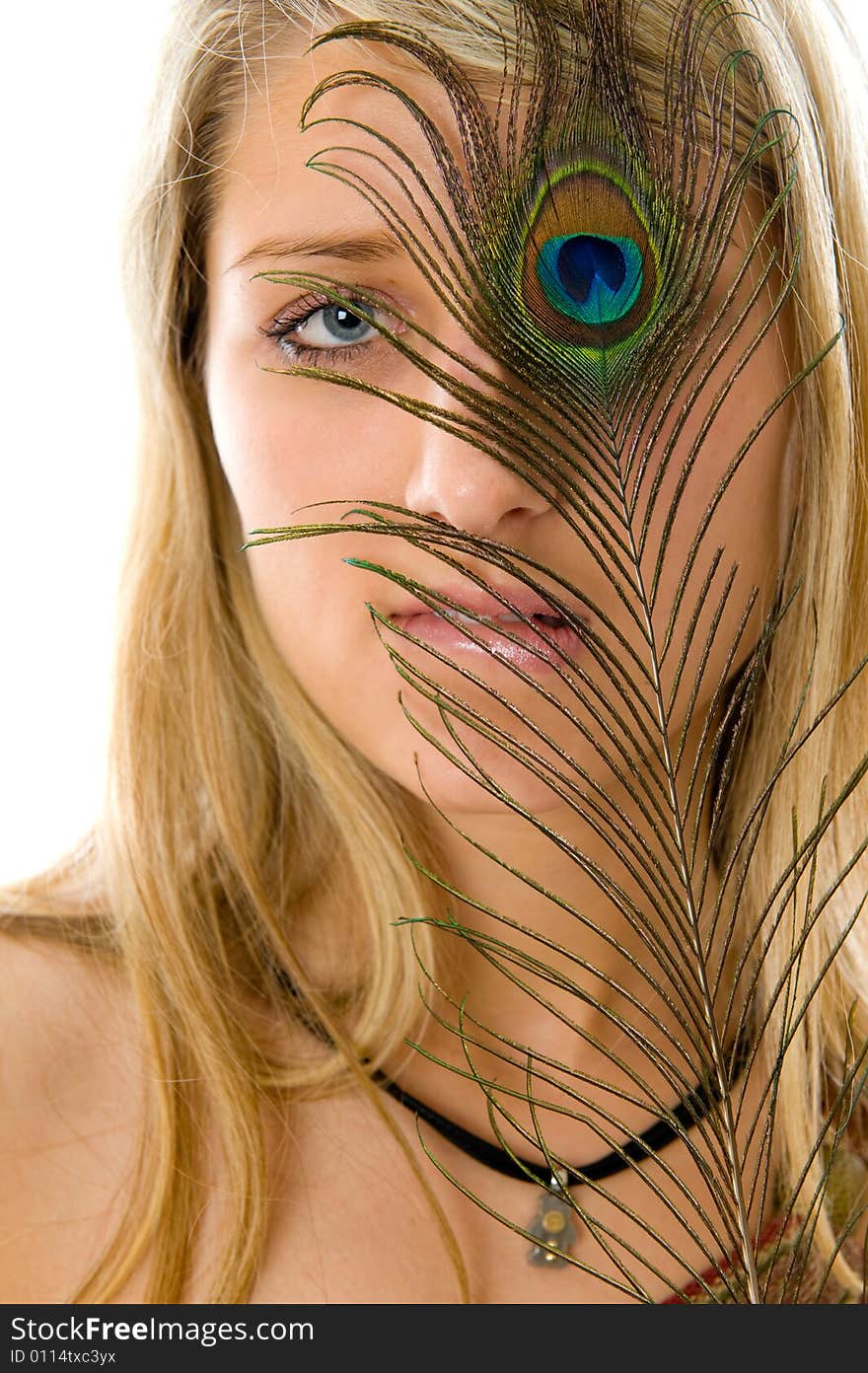 Portrait of beautiful girl with peacock a feather. Isolated over white background