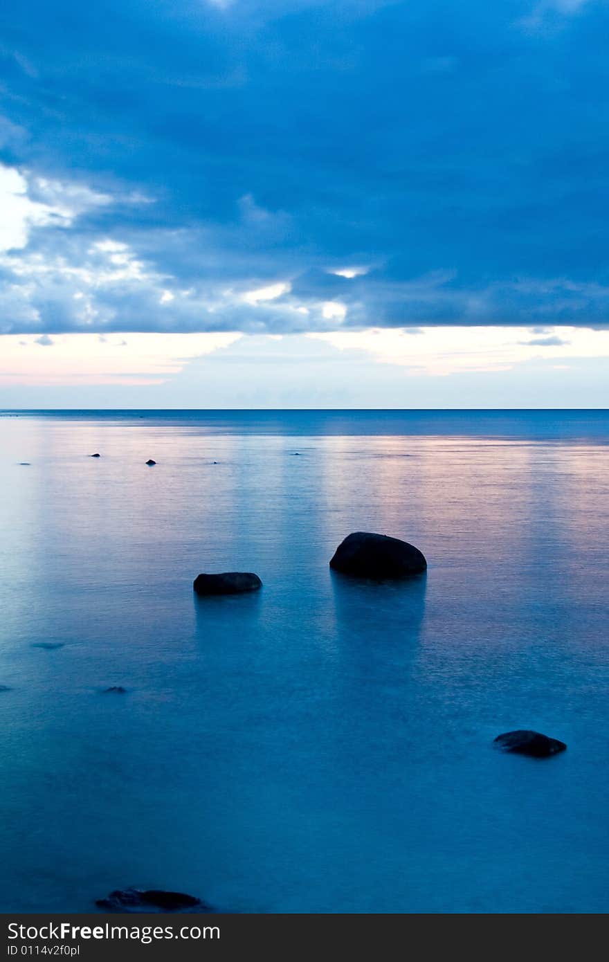 Stones in the sea at night.