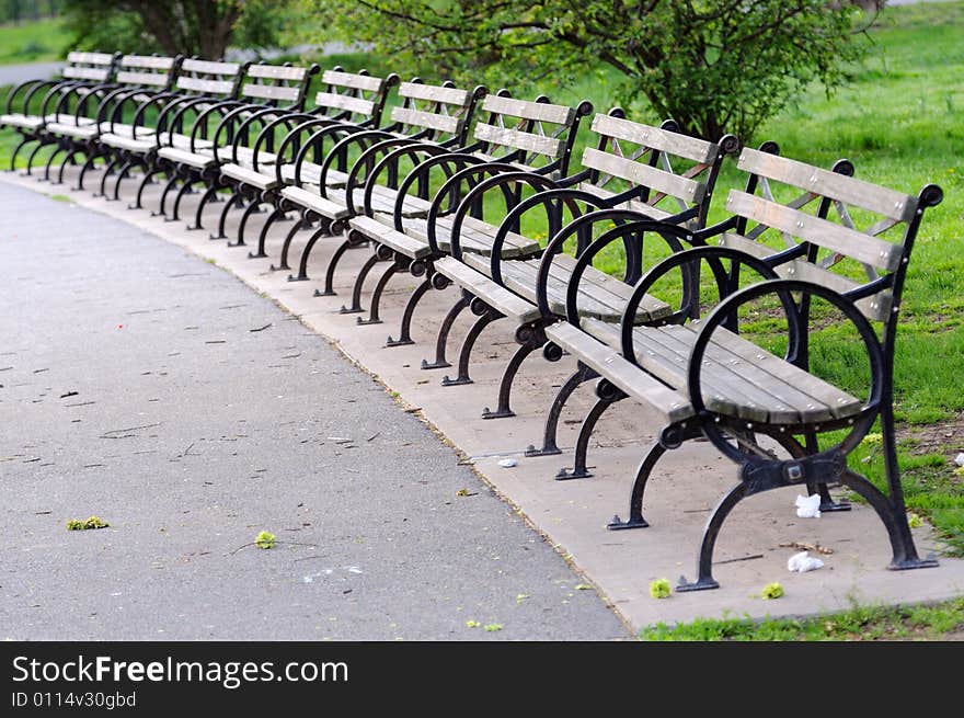 Benches by a half-round in park. Nobody is present. Benches by a half-round in park. Nobody is present