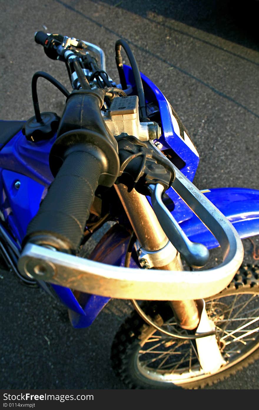 Blue Dirt Bike in Sunlight