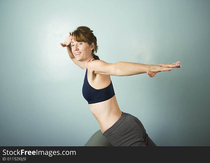 Athletic Woman Exercising and Stretching on Gym Equipment