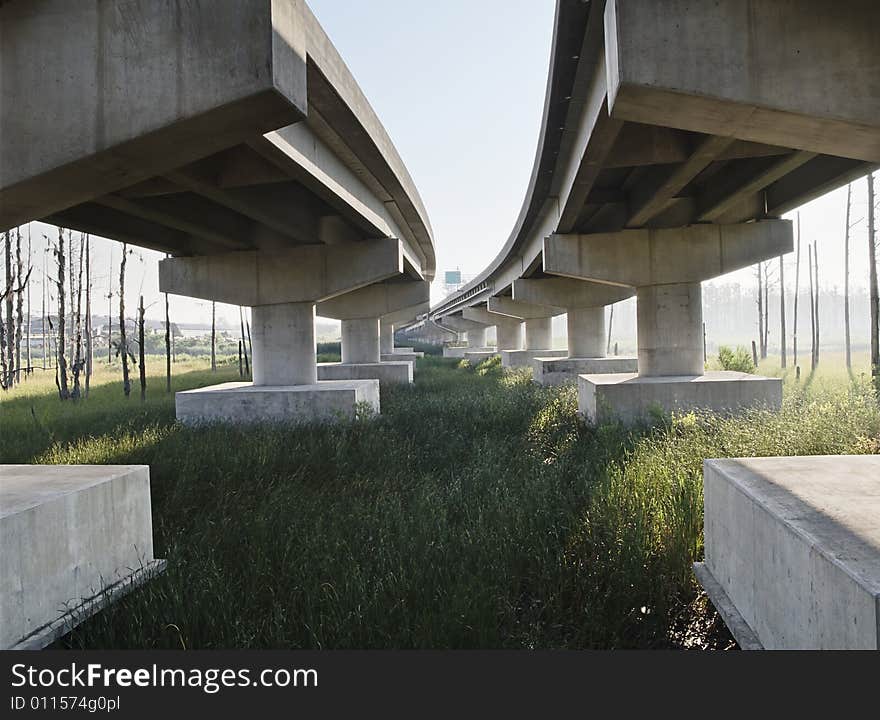 View of underneath highway through mash land as the sun rises. View of underneath highway through mash land as the sun rises.