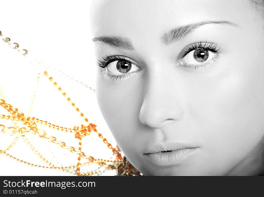 Portrait of a cute lady in monochrome with yellow beads on white background. Portrait of a cute lady in monochrome with yellow beads on white background