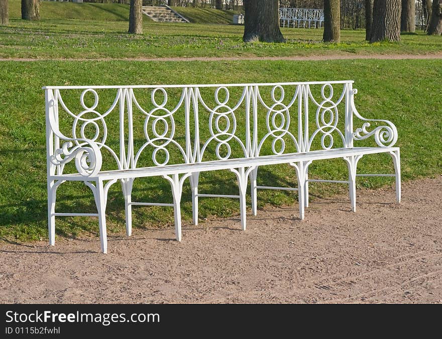 Laced metal bench in a park lane, town of Pushkin, Russia. Laced metal bench in a park lane, town of Pushkin, Russia