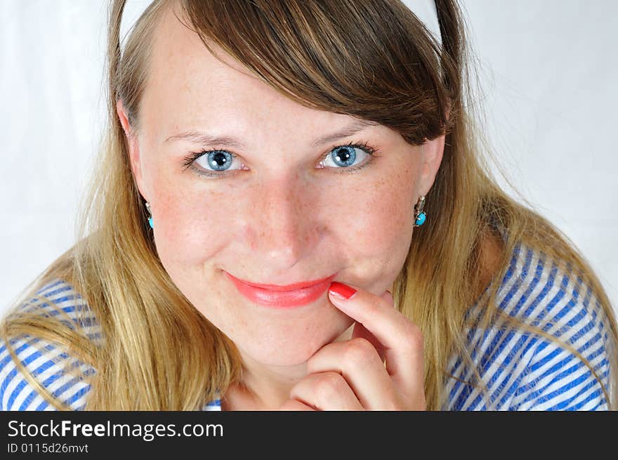 Happy smiling blue-eyed girl look at camera