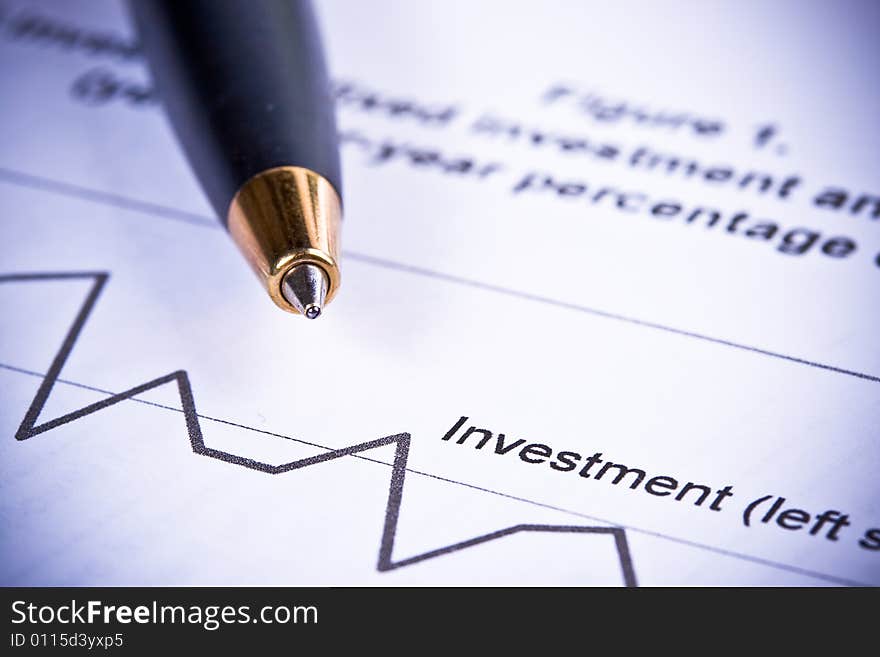 Pen and diagramm of investment. Close up.