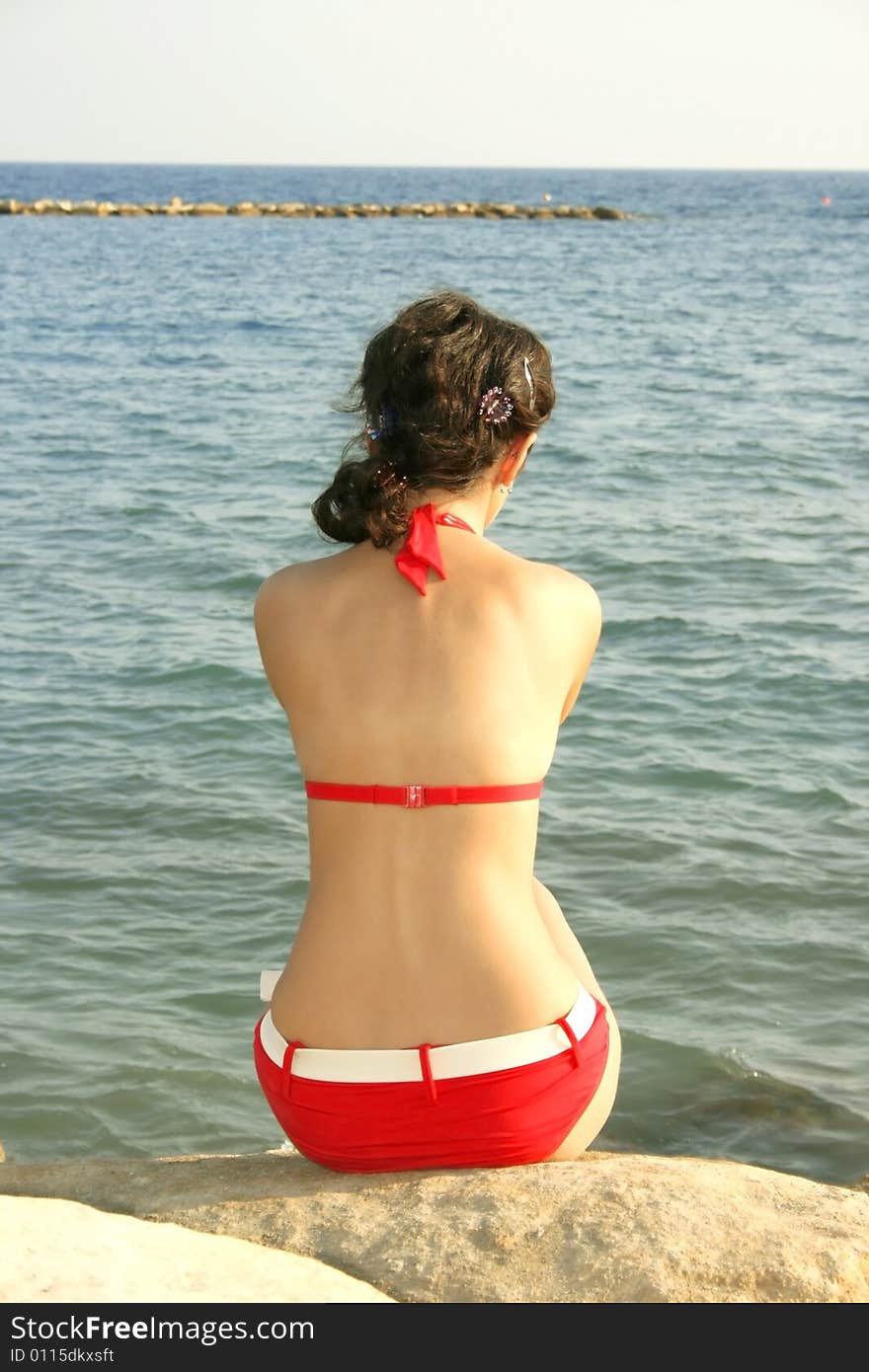 Prety girl in red bikini on the beach. Prety girl in red bikini on the beach.