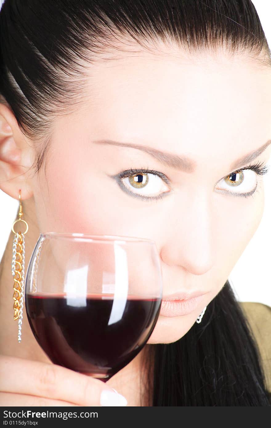 Portrait of a cute brunette holding a glass of red wine on white background. Portrait of a cute brunette holding a glass of red wine on white background