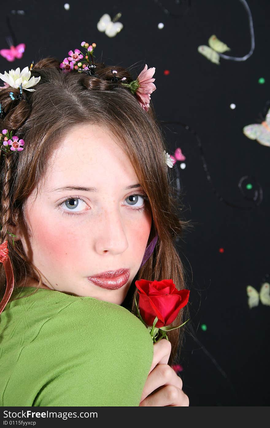 Teenage model with flowers and butterflies in her hair. Teenage model with flowers and butterflies in her hair