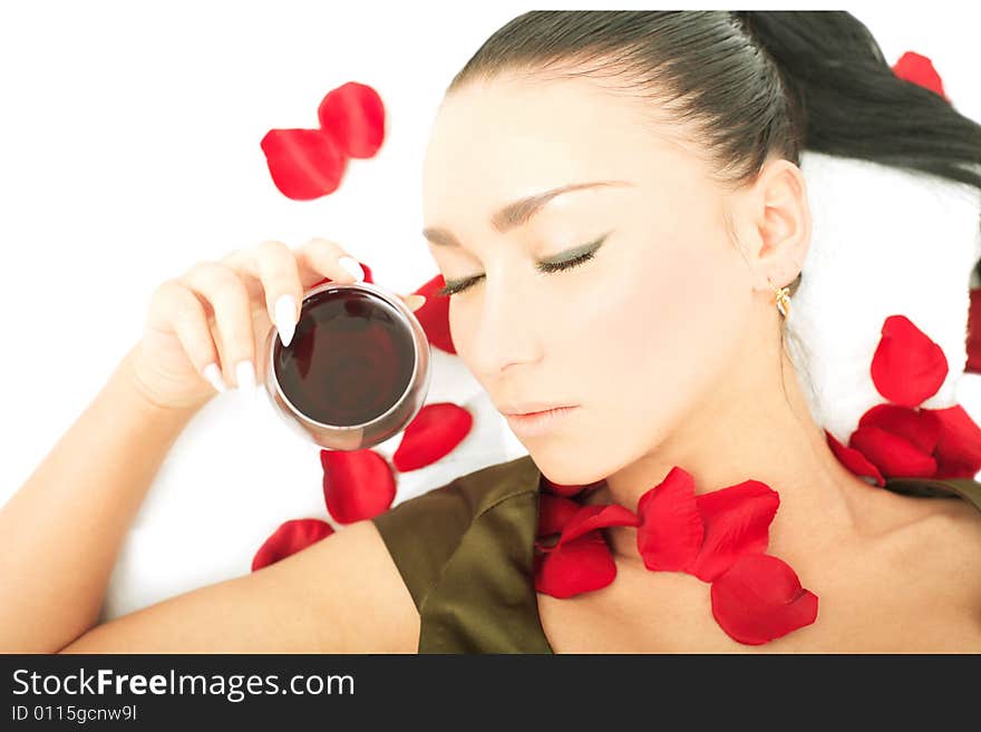 Portrait of a cute lady lying with petals on white background. Portrait of a cute lady lying with petals on white background