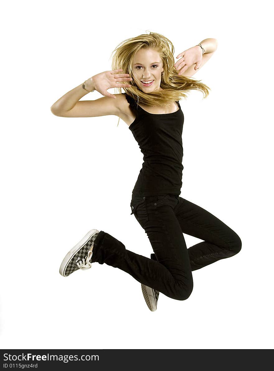 A beautiful blond Caucasian young girl (15-24) jumping with joy on white background, model release. A beautiful blond Caucasian young girl (15-24) jumping with joy on white background, model release