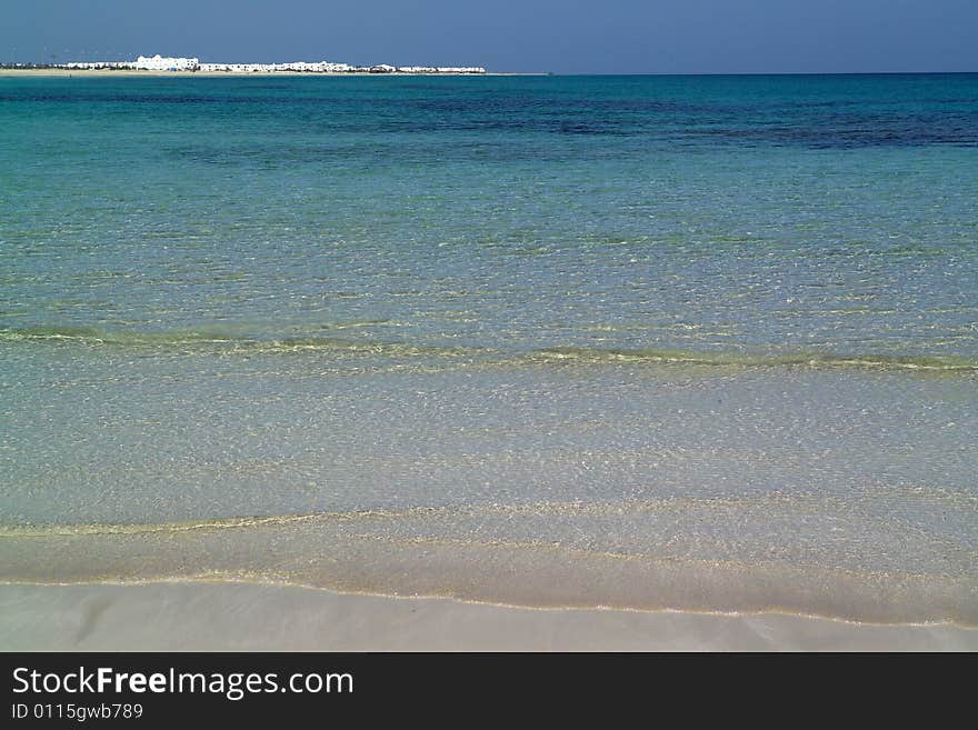 Exotic beach under a blue sky. Exotic beach under a blue sky