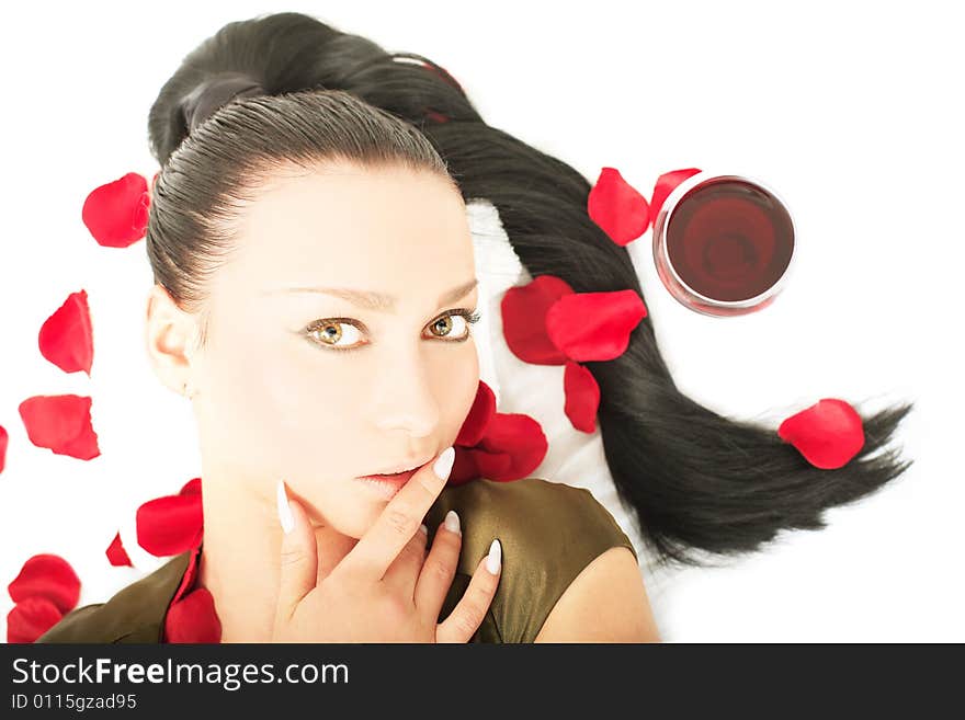 Portrait of a cute lady lying with petals on white background. Portrait of a cute lady lying with petals on white background