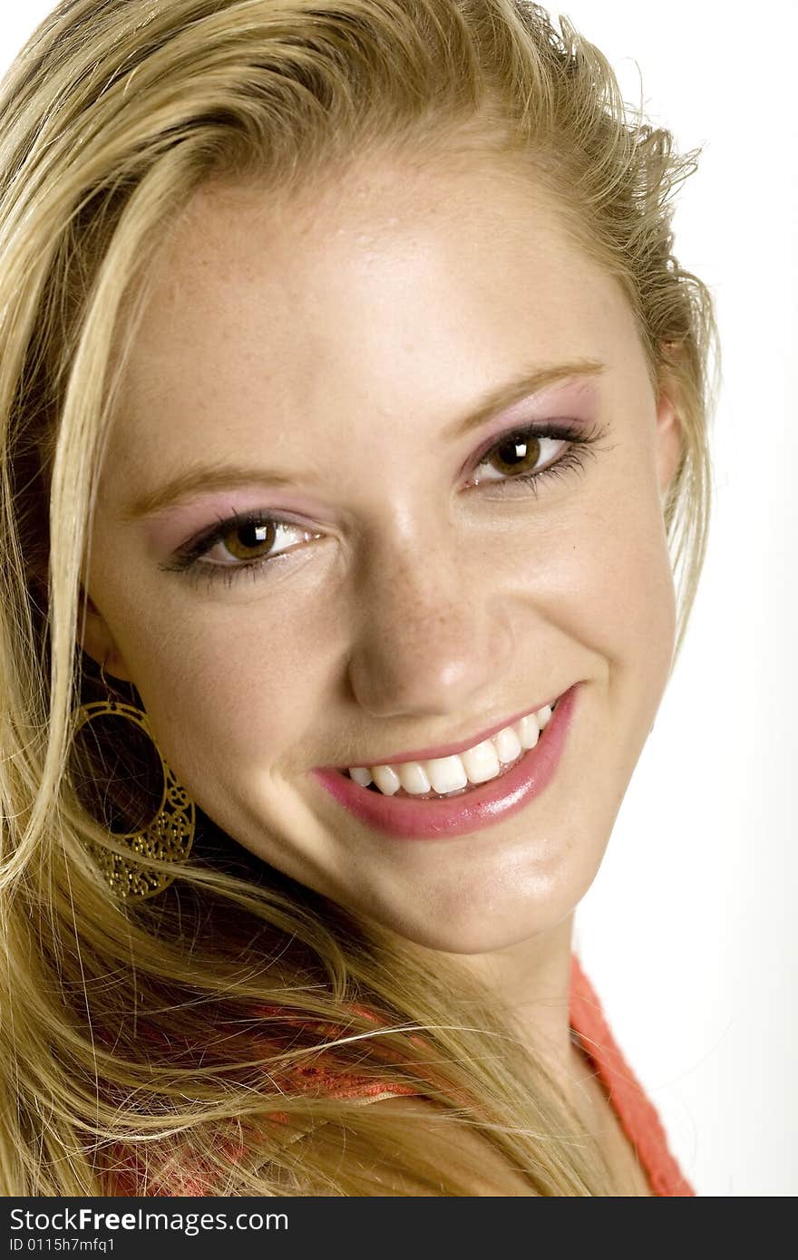 A portrait of a beautiful blond smiling Caucasian young girl (15-24) on white background, model release. A portrait of a beautiful blond smiling Caucasian young girl (15-24) on white background, model release.