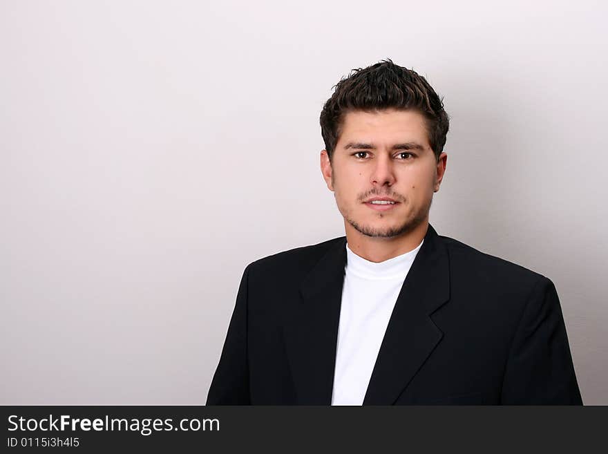 Male model in studio against white wall