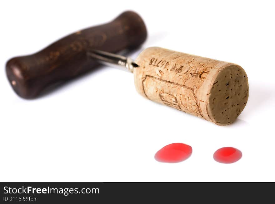 Corkscrew isolated on white background with two drops of red wine. Corkscrew isolated on white background with two drops of red wine