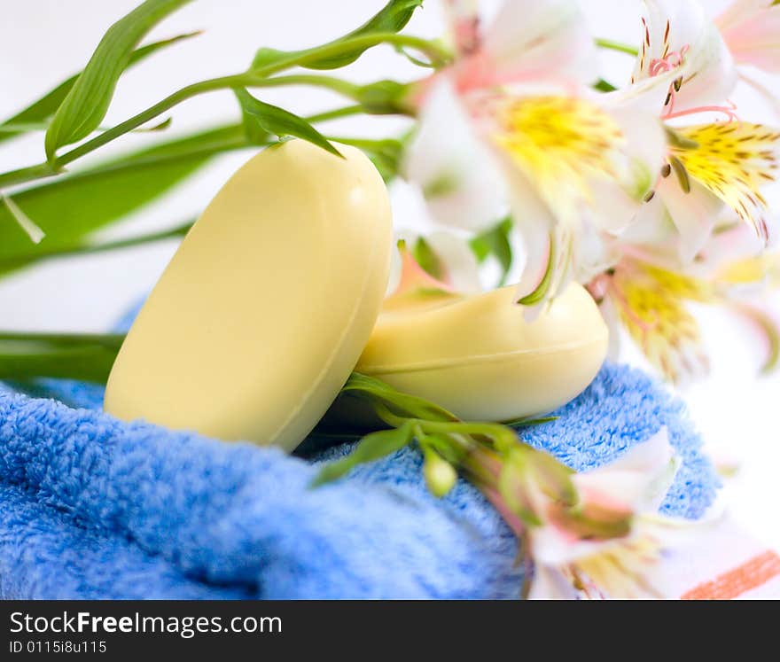 Soap and flower on blue fabric