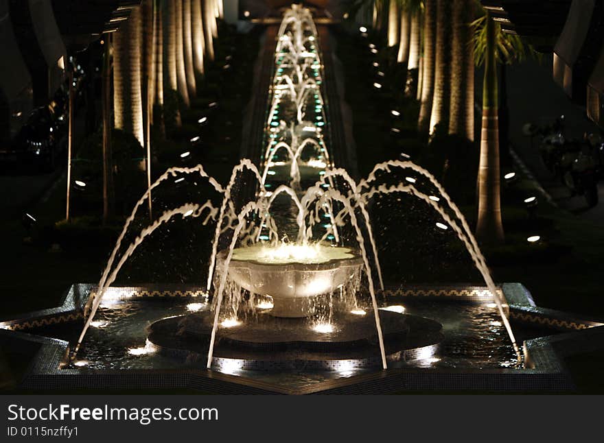 A water fountain at night.