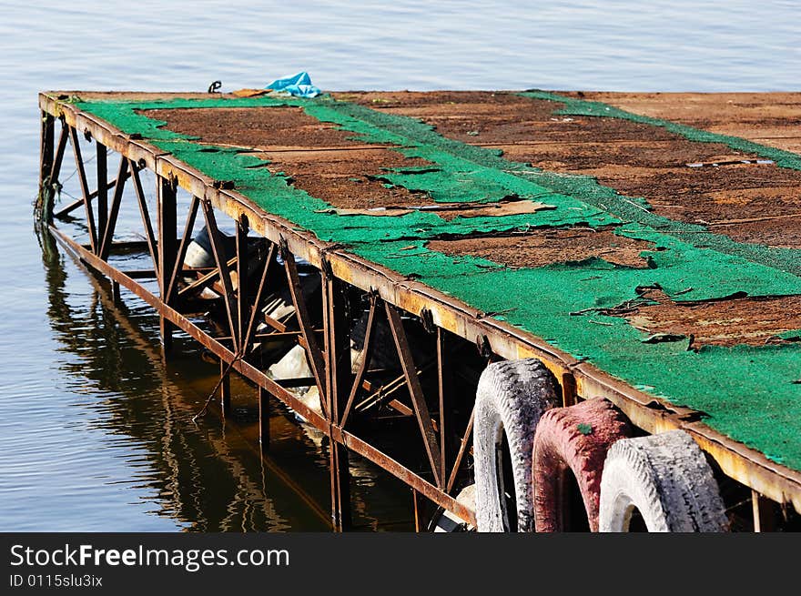 A beat-up marina in the lake.