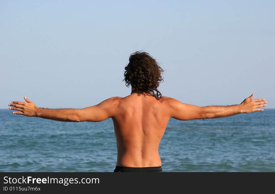 A man embracing the sea. A man embracing the sea