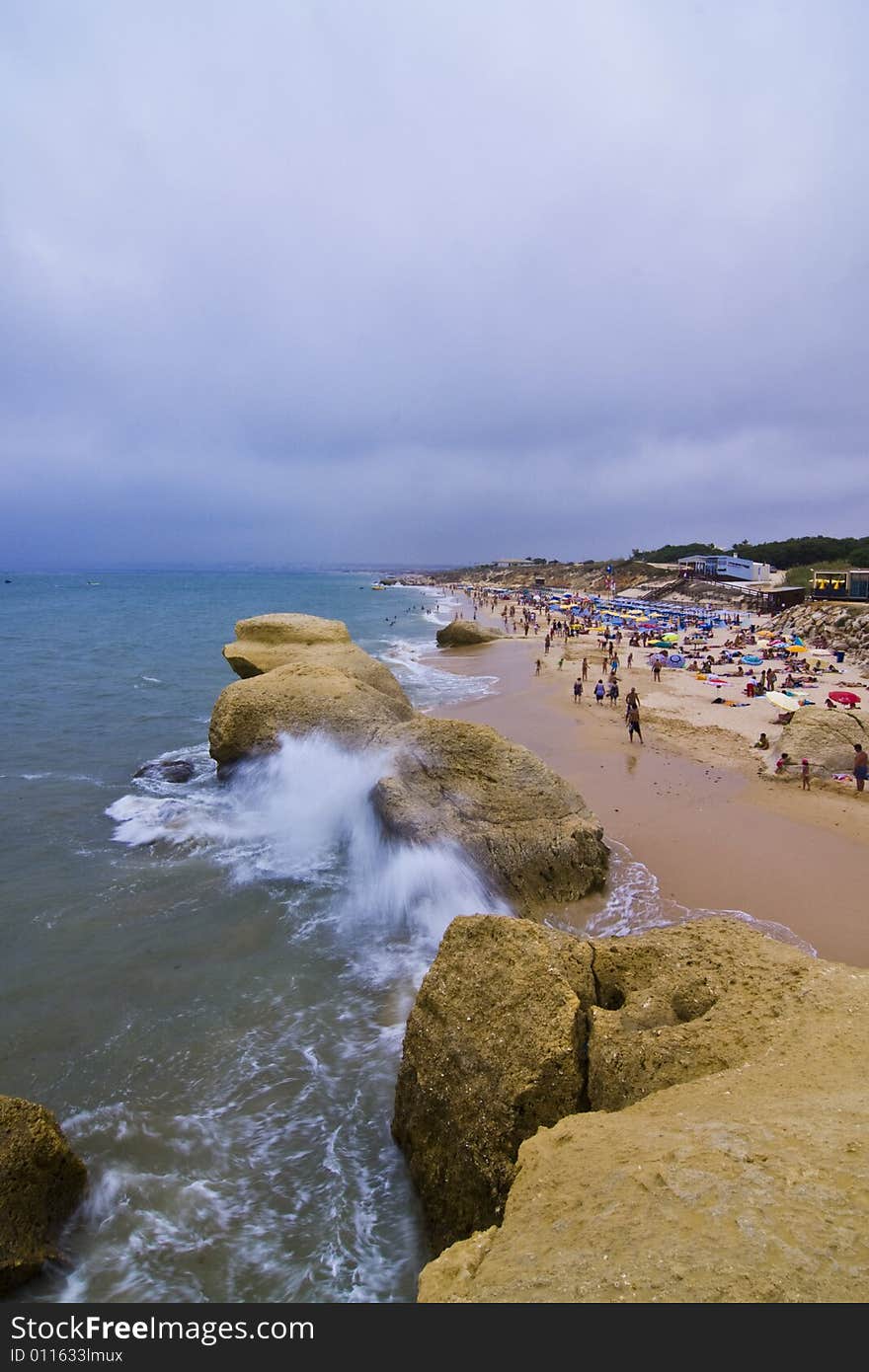 Storm over Algarve Gale beach full of tourists. Storm over Algarve Gale beach full of tourists.