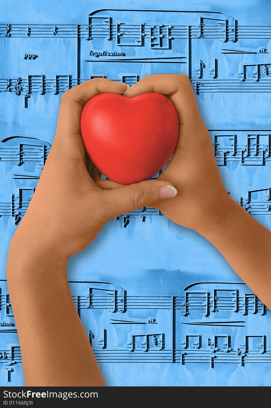 Girl hands holding red heart shape. Musical notes as background. Path for hands and hearth,. Girl hands holding red heart shape. Musical notes as background. Path for hands and hearth,