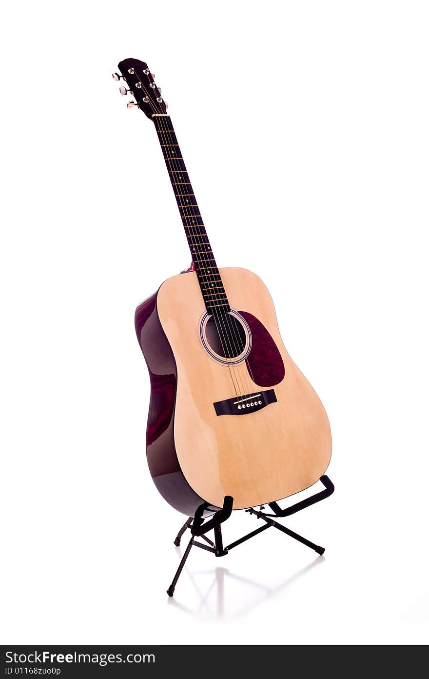 A classic dreadnought guitar on a white background. A classic dreadnought guitar on a white background