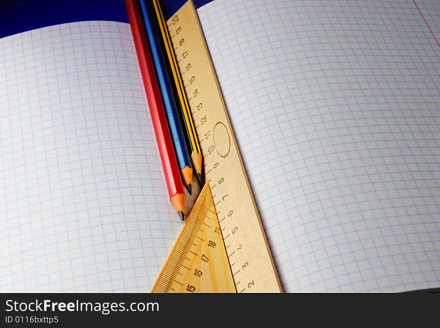 Different rulers, multi color pencil and notebook