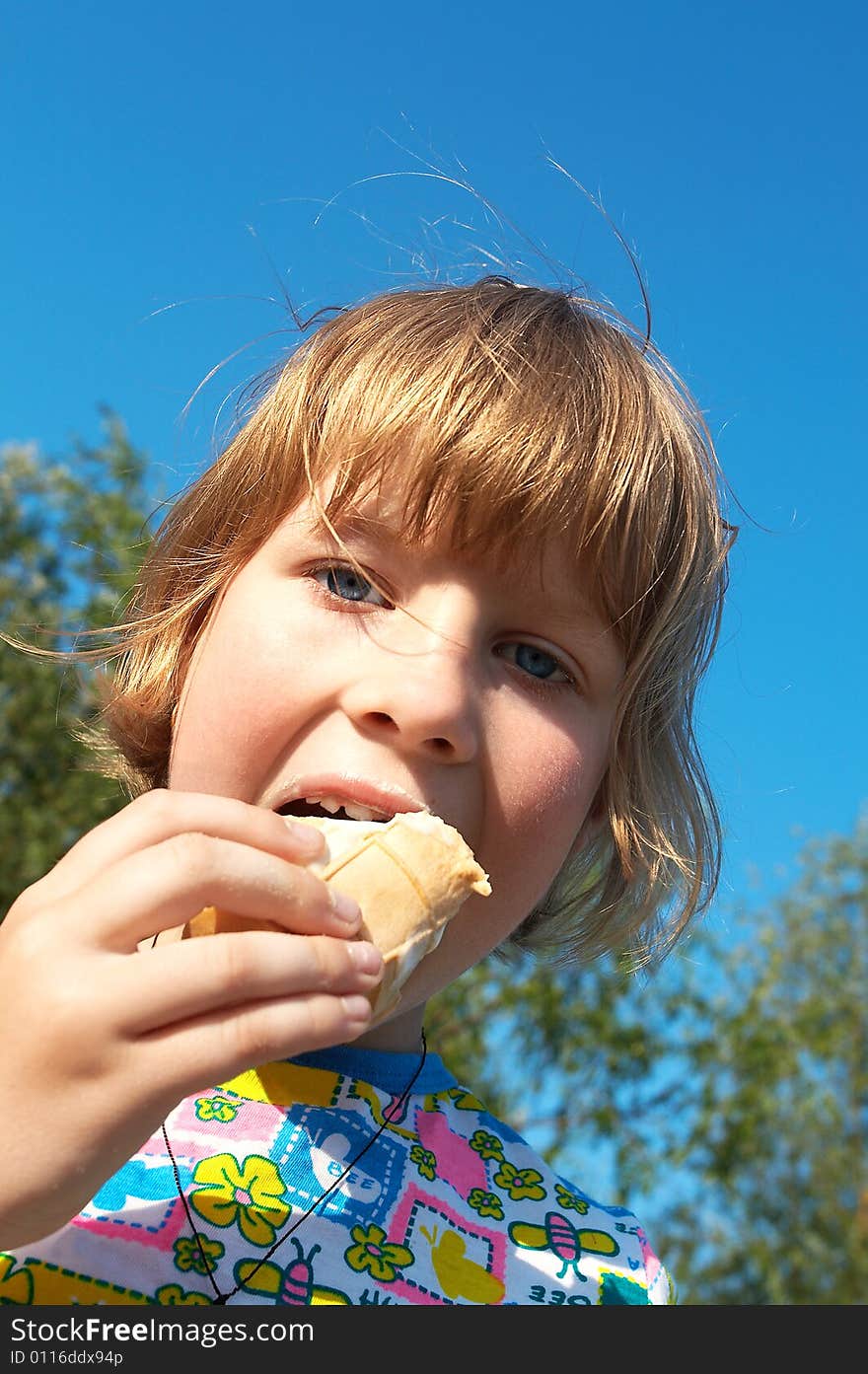 Pretty little girl eating ice-cream. Pretty little girl eating ice-cream