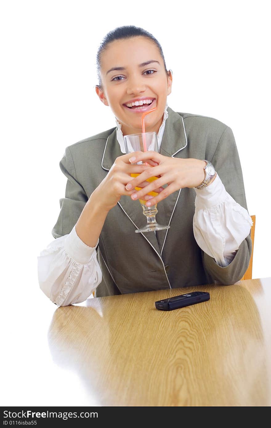 Cheerful businesswoman drinking juice