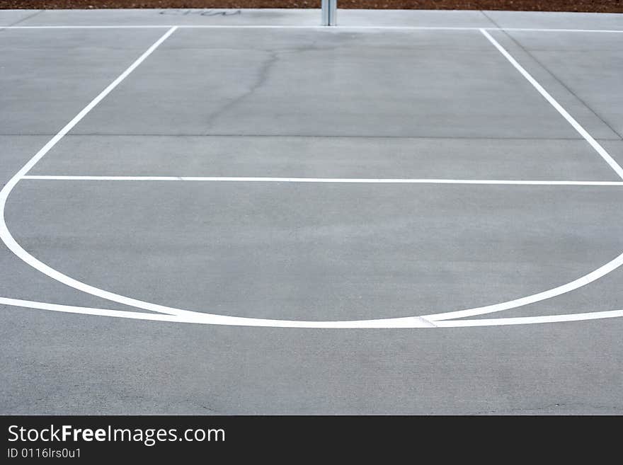 A basket ball hoop on an out door court