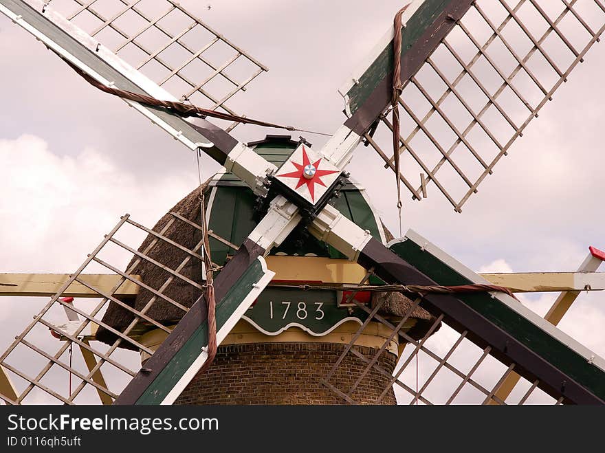 A detail of a water wind mill in the county