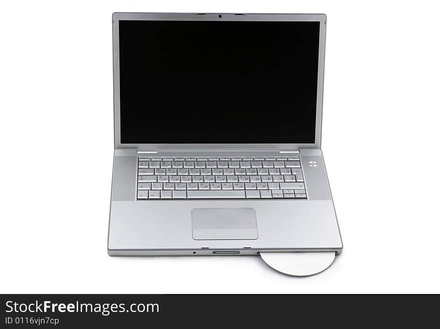 Silver portable computer with CD inserted. Front view. Silver portable computer with CD inserted. Front view.