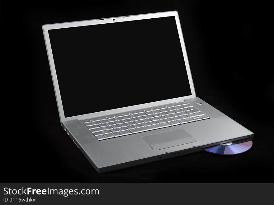 Laptop isolated with CD