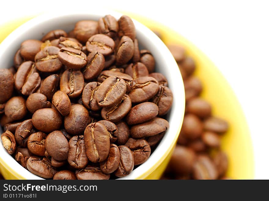 Cup  with roasted coffee beans. Cup  with roasted coffee beans